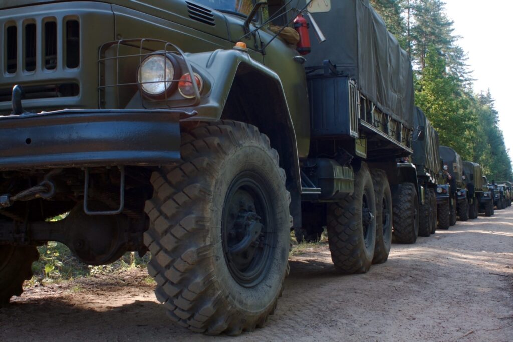 Military cars driving in the road, representing how one can benefit from calling a Portland criminal defense attorney.